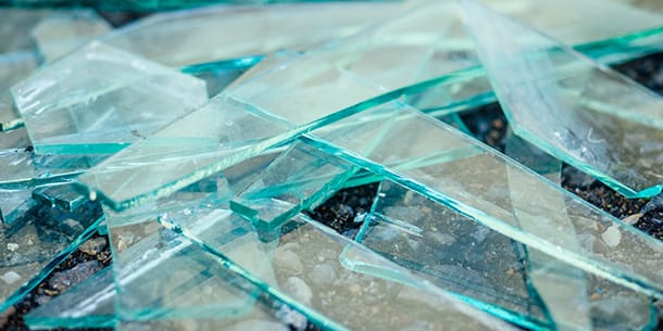 Broken shards of glass scattered on the ground
